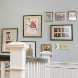 Family gallery wall by the staircase